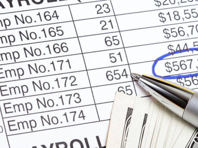 Close up of a payroll spreadsheet with employee numbers and amounts, statutory pay in BC explained for workers and employers.