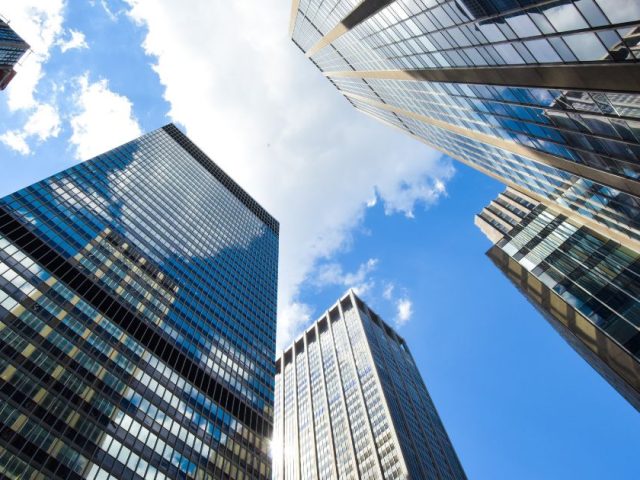 Toronto corporate skyscrapers from below as Ontario Court invalidates CIBC termination clause in landmark employment ruling.