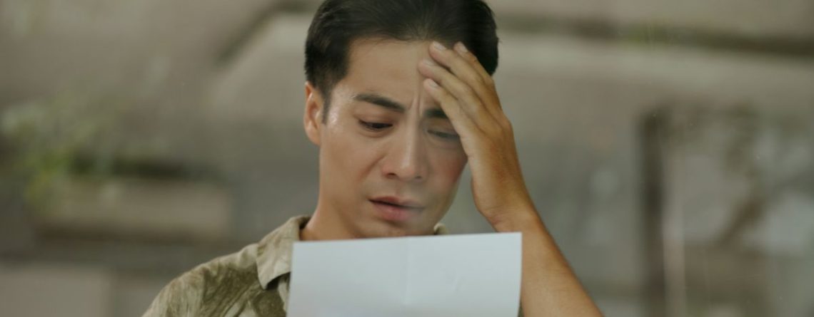 Worried man reading a letter, what Ontario employees should know before responding to their employer about workplace issues.