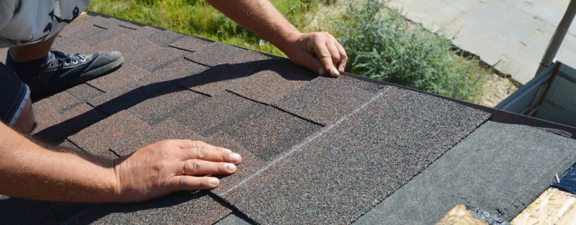 Roofer installing shingles on a residential roof, representing the roofing industry context of the Baker v. Firon Roofing case.