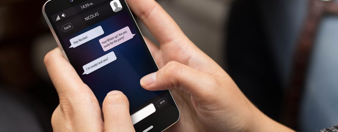 Person reading a private messaging chat on a smartphone, illustrating off-duty conduct in the Metrolinx harassment case